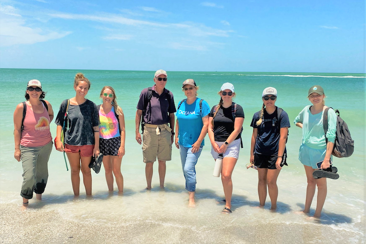 USF Patel College graduate students Ali Farr, Sophia Annis, Jesse Coates, Samantha Vorce, Shannon Ward, and Kristina Rocks with Richard Sanchez of the Egmont Key Alliance and PCGS Sustainable Tourism Concentration Director Dr. Brooke Hansen (center).