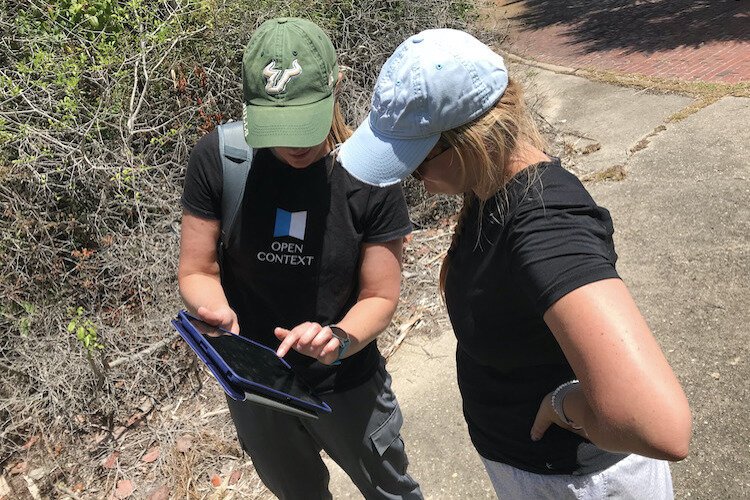 USF Access 3D Lab Director Dr. Laura Harrison and Patel College Sustainable Tourism graduate student Samantha Vorce work to 3D-scan historic sites at Egmont Key using an iPad.