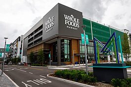 The new Midtown Tampa Whole Foods Market includes a full-service butcher, coffee bar, and certified cheese professional.