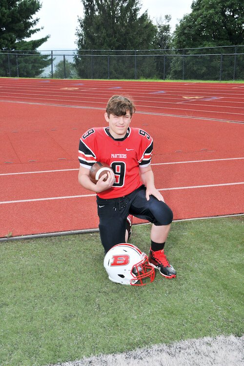 High School student Cole Davis back in uniform after life-saving cancer treatment.