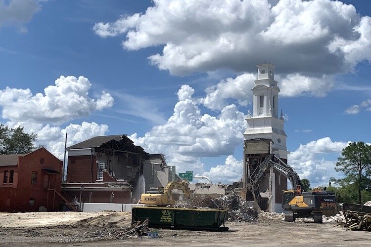 Demolition crews raze the 72-year-old church building in August 2021, leaving in place the former Tampa Fire Department Station 7 (left), which was built in 1924 and later incorporated into the Seminole Heights Baptist Church parish.