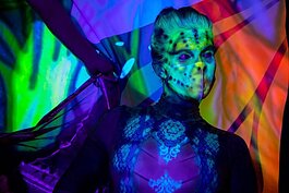 Shanna Mellow, a performer with The Curiositorium LLC in St. Pete, performs at the Neon Jungle-themed Pride & Passion event.