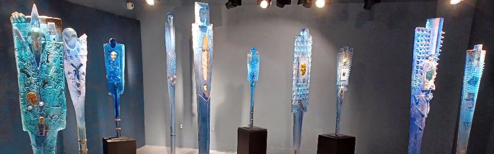 Standing glass sculptures in one of the Imagine Museum’s exhibit halls.