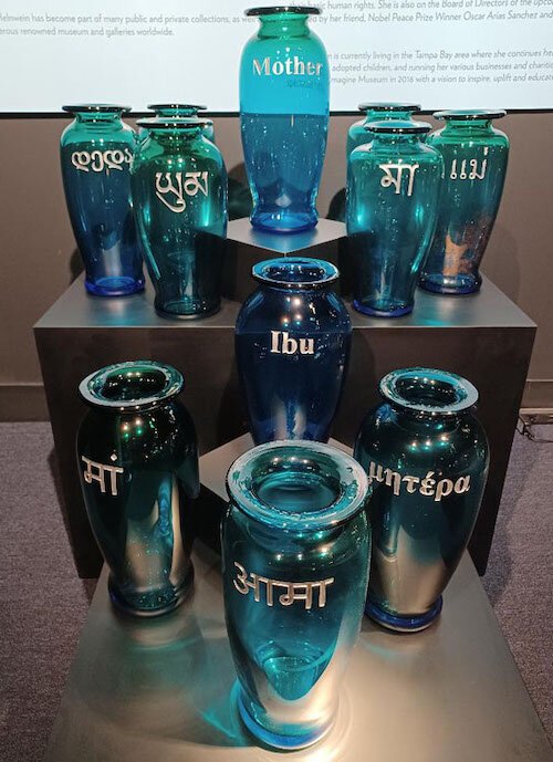 A collection of glass containers honoring “Mother”