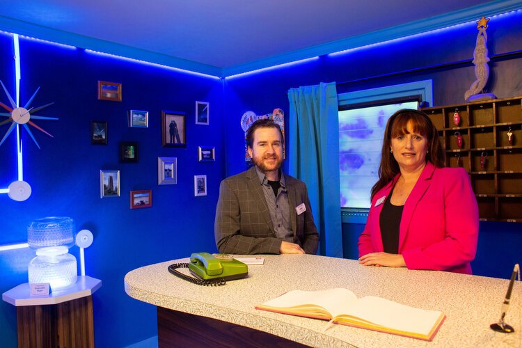 Michail Mansions and Liz Dimmitt, co-Founders of Fairgrounds St. Pete, stand inside the Mermaid Star Motel retro beach vibe lobby.