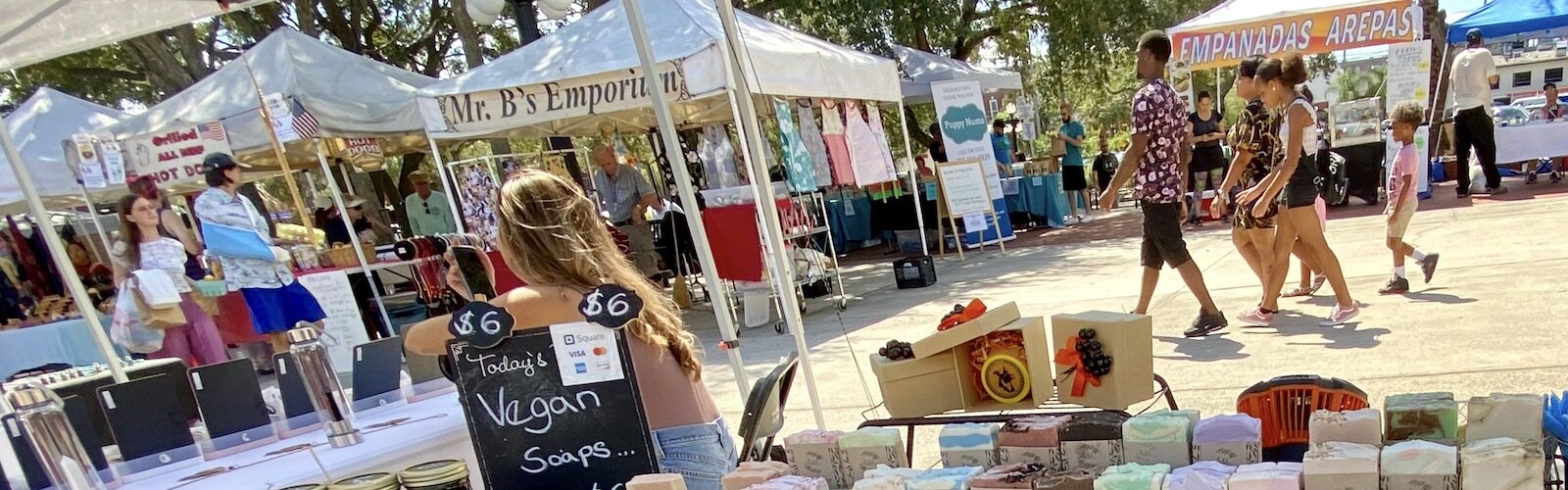 A&C (Aroma and Color), a family-owned company in Tampa, sells hand-made soaps in the midst of a sea of vendors and visitors to the Saturday Market.