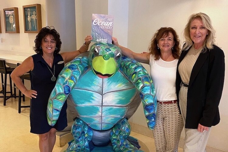 Ocean Allies Secretary Lynne Grant, Mary Reischmann, Director of Sales at Hyatt, and Sheri Heilman, Founder of Ocean Allies and Owner of Heilman’s Beachcomber and Bobby’s Bistro, celebrate recertification of Hyatt’s restaurants as Ocean Friendly.