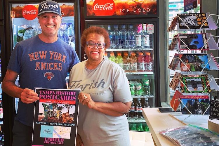 Local restaurateur Keith Sedita of Florish, a plant-based eatery in South Tampa, shopped the Tampa History Postcard Limited Edition Sale at Dolce Cafe' + Marketplace-Park Tower. Gloria Jean Royster is on the right.