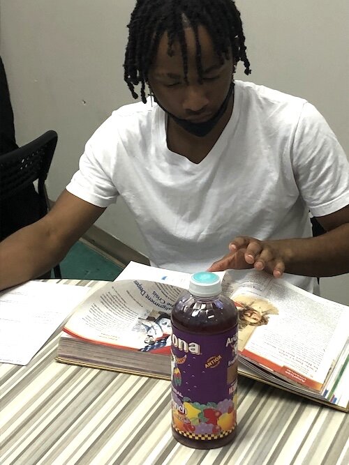 A student learns to express himself in writing as part of the program offered by Gentleman's Quest of Tampa Bay. 