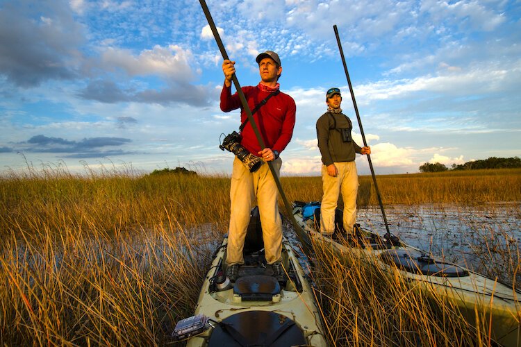 Photographer Carlton Ward Jr and biologist Joe Guthrie, background, pole their kayaks through Everglades National Park in 2012 during the first expedition to raise awareness for the Florida Wildlife Corridor.