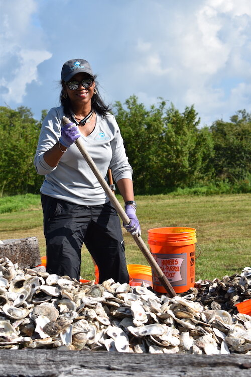 Volunteers used 30 tons of oyster shells donated by Manatee County restaurants to build oyster reef substrate in Perico Bayou in Bradenton, Fla. during an SBEP work day.