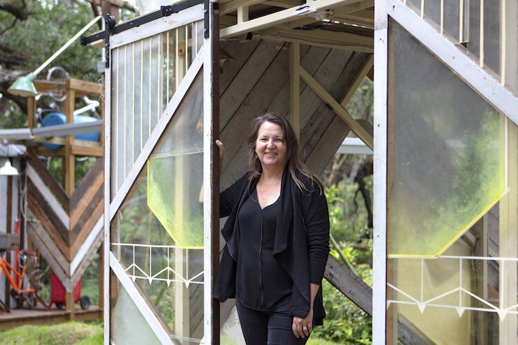 Sarah Howard at the entrance of one of the architectural components of the Music Box Project.