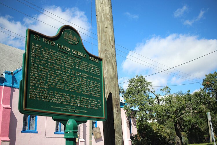 St. Peter Claver Catholic School is named after the Spanish Jesuit priest known as the patron saint of slaves. The original school built by nuns on Morgan Street opened on Feb. 12, 1894, and was burned down 10 days later by opponents.