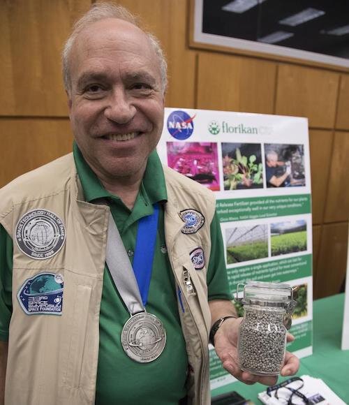 Ed Rosenthal of Sarasota, founder of Florikan, displays his plant growth material.