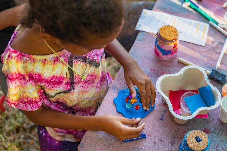 Children enjoy hands-on experiences at the SPACEcraft Make/Play station at Lake Vista Park.