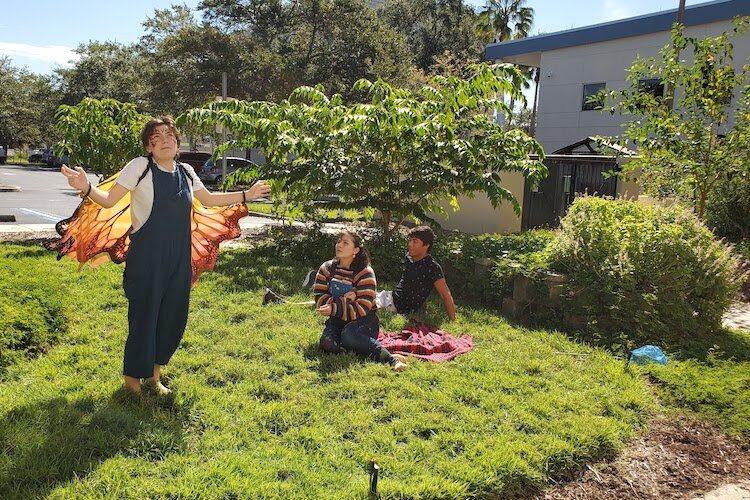 Students activate the space of the NEST garden with spoken word and performance.