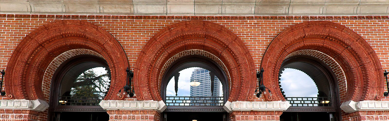 The relief designs in the Moorish arches above Plant Hall’s entrance were the inspiration for the patterns circling the top and bottom of the four larger bells of the Ars Sonora structure.