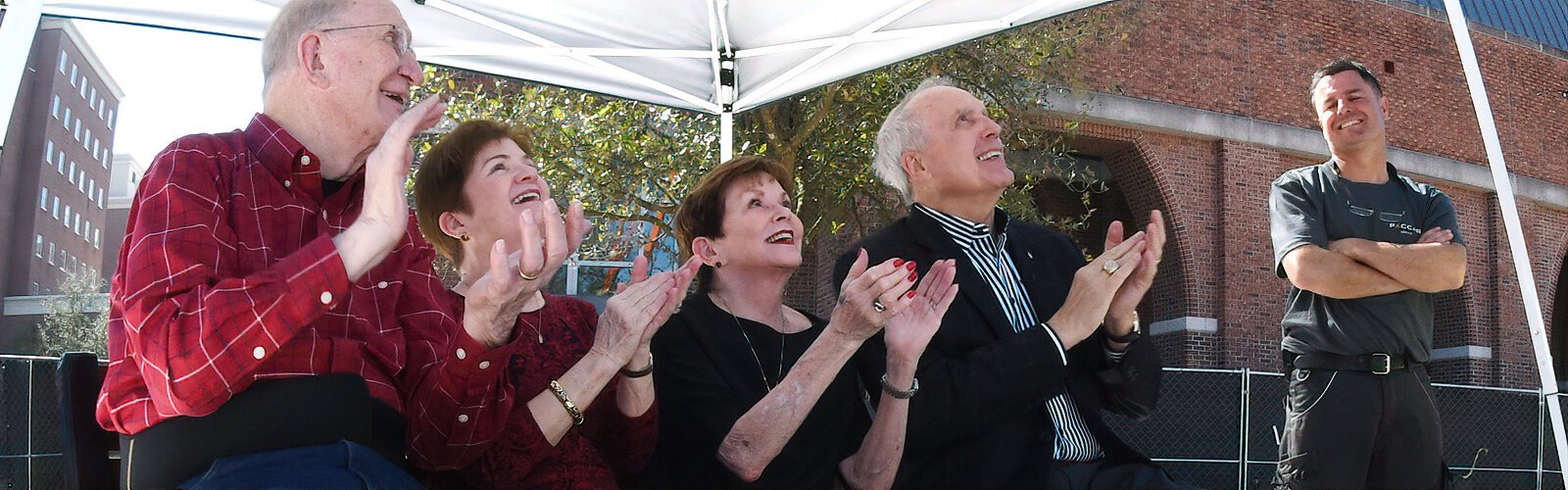 UT benefactors John and Susan Sykes and Renée and President of UT Ron Vaughn applaud at the completion of the construction of the Ars Sonora as a satisfied Cyril Paccard of Paccard Bell Foundry in France appreciates their reaction.