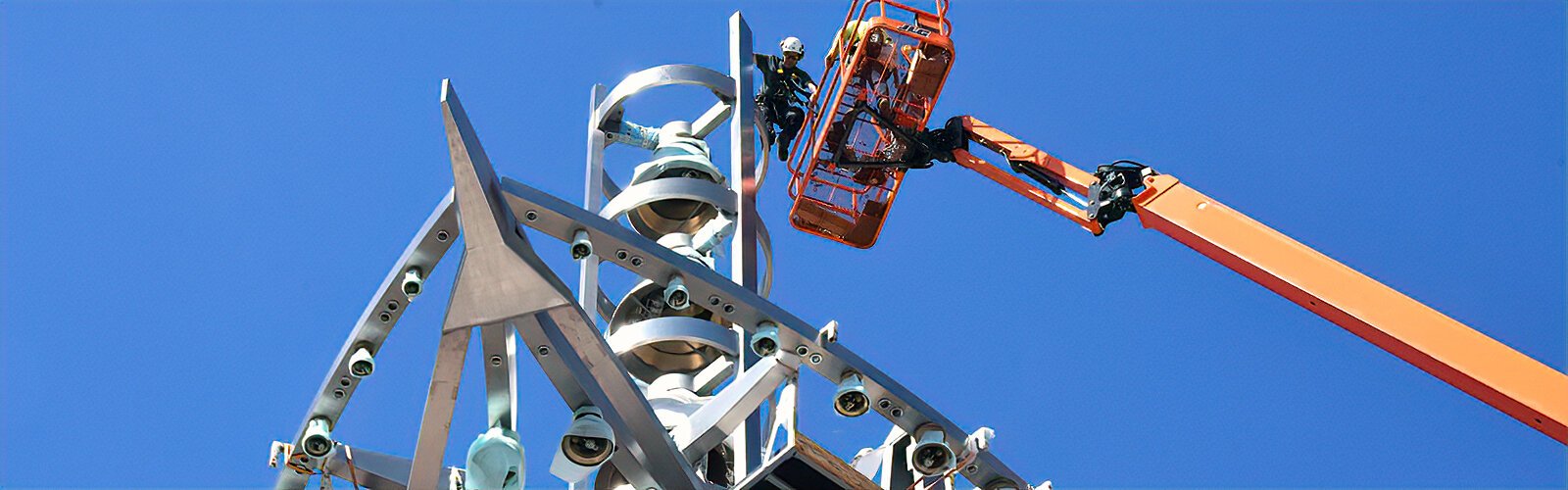 Engineer Cyril Paccard climbs on the top element of the Ars Sonora. Responsible for the harmonics, the Paccards will connect all the wiring from the bells to the control room in the Sykes Chapel.