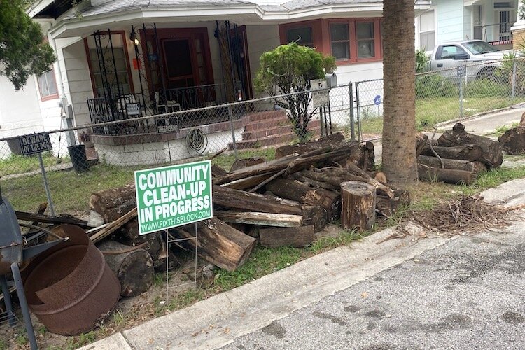 The nonprofit Center for Economic Development organized a community cleanup for several homes in East Tampa, including one owned by longtime resident Ernest Braxton.