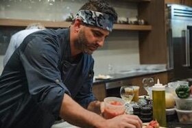 Executive Chef-Owner Michael Buttacavoli is busy in the Cena kitchen.