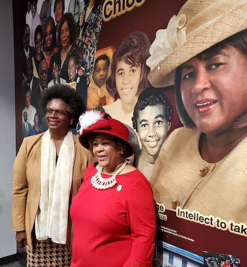 Chloe Coney stands beside Ersula K. Odom, the artist and friend who designed the legacy wall depicting Coney's life and service to the community.