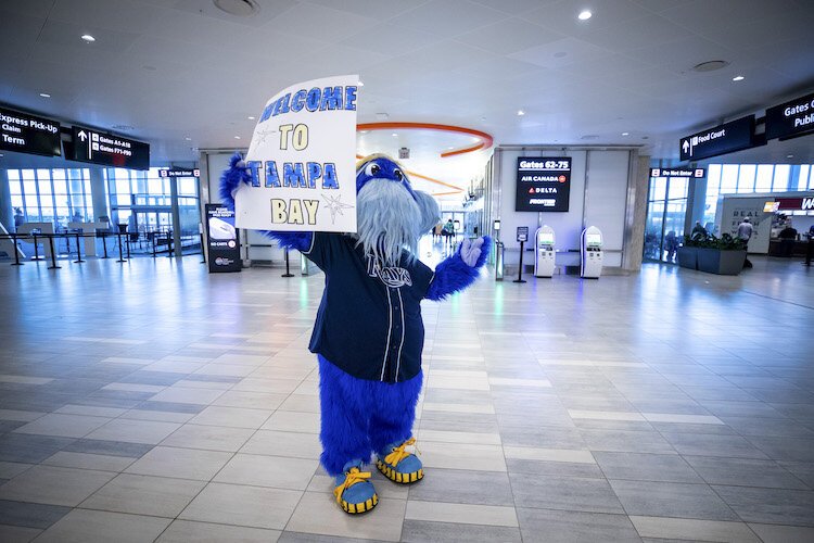 Raymond greets people at Tampa International Airport as part of National Random Acts of Kindness Day in Tampa, FL, on February 17, 2022.