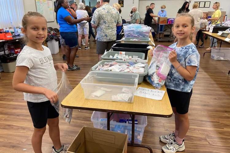 The youngest members of Epiphany of Our Lord Ukrainian Catholic Church helping pack supplies for Ukraine refugees.