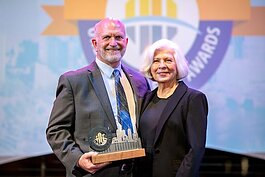 Joe Waggoner (pictured with his wife Ann) accepts the Tampa Downtown Partnership’s 2022 Urban Excellence Awards Christine Burdick Downtown “Person of The Year” award.