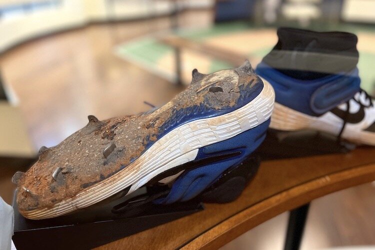 Muddied cleats donated by New York Mets’ Pete Alonso.