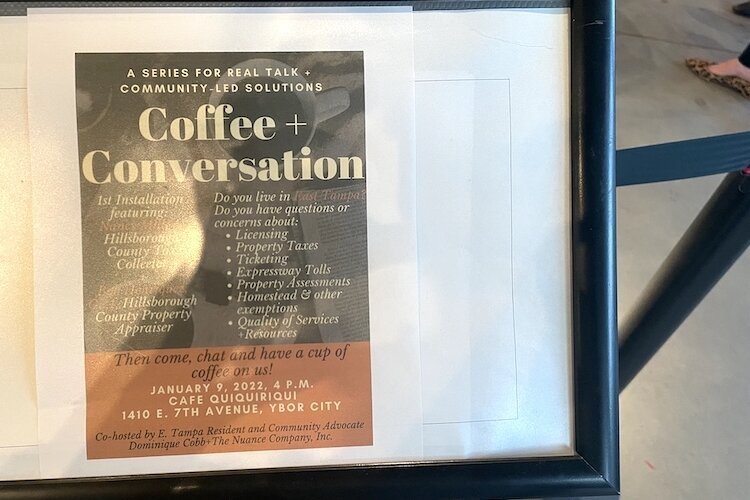 Signage guides guests to Coffee + Conversations at Cafe Quiquiriqui in Ybor City.