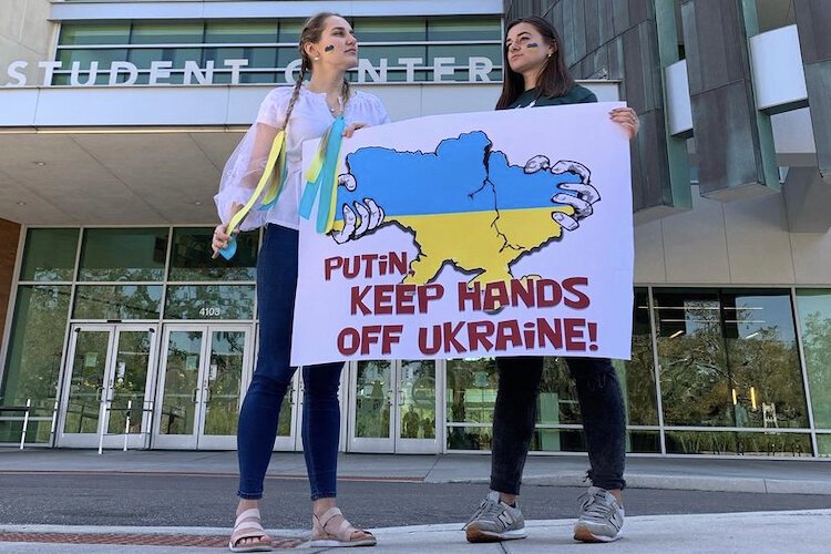 Anastasiya Pylypenko with her friend and fellow Ukrainian native, Lesia, a USF student, protesting the Russian invasion of Ukraine.