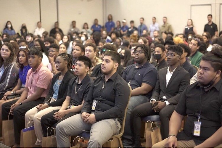Students from Armwood, King and Middleton high schools listen to presenters from the Future Career Academy kick off the Future Fair in East Tampa.