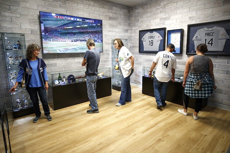 Fans share memories as they tour the new Rays Museum at Tropicana Field in St. Petersburg, FL.