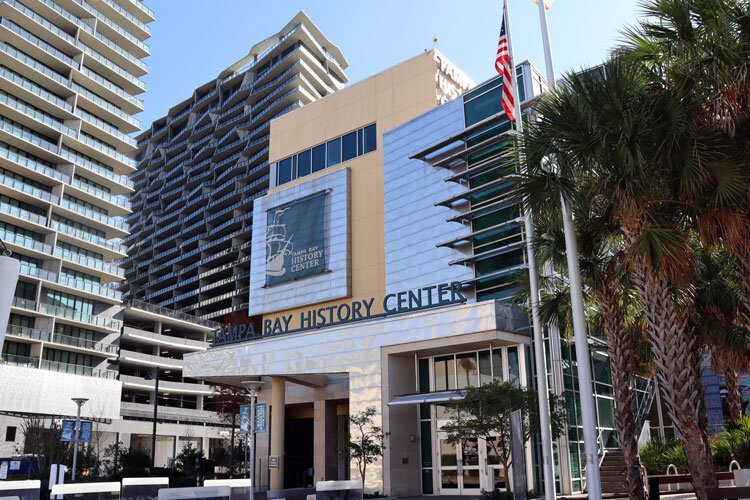 The Tampa Bay History Center sits on the Tampa Riverwalk surrounded by the emerging Water Street Tampa development.