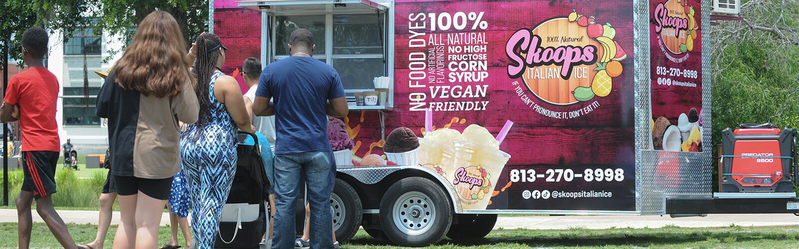 People line up for a cool Italian Ice from one of the vendors at the Multicultural Family Day event at Water Works Park Sunday.