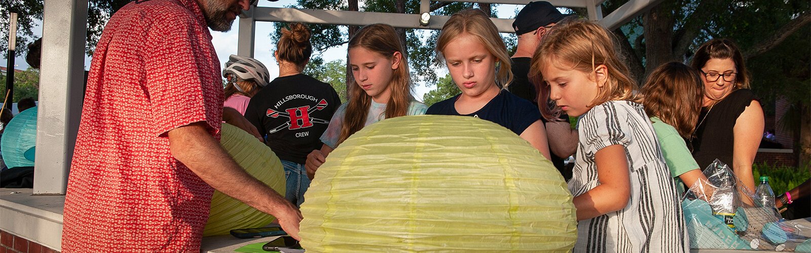 (l-r) Sloane Wilson, 10, Delaney Driscoll, 10 and Emma-James Driscoll, 6, make lanterns for the first Riverfest Lantern Parade