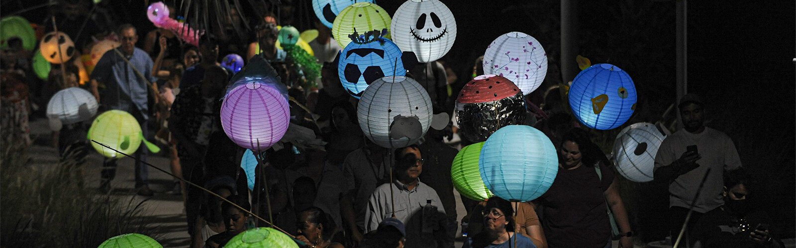 The Lantern Parade moves along Riverwalk Saturday night.