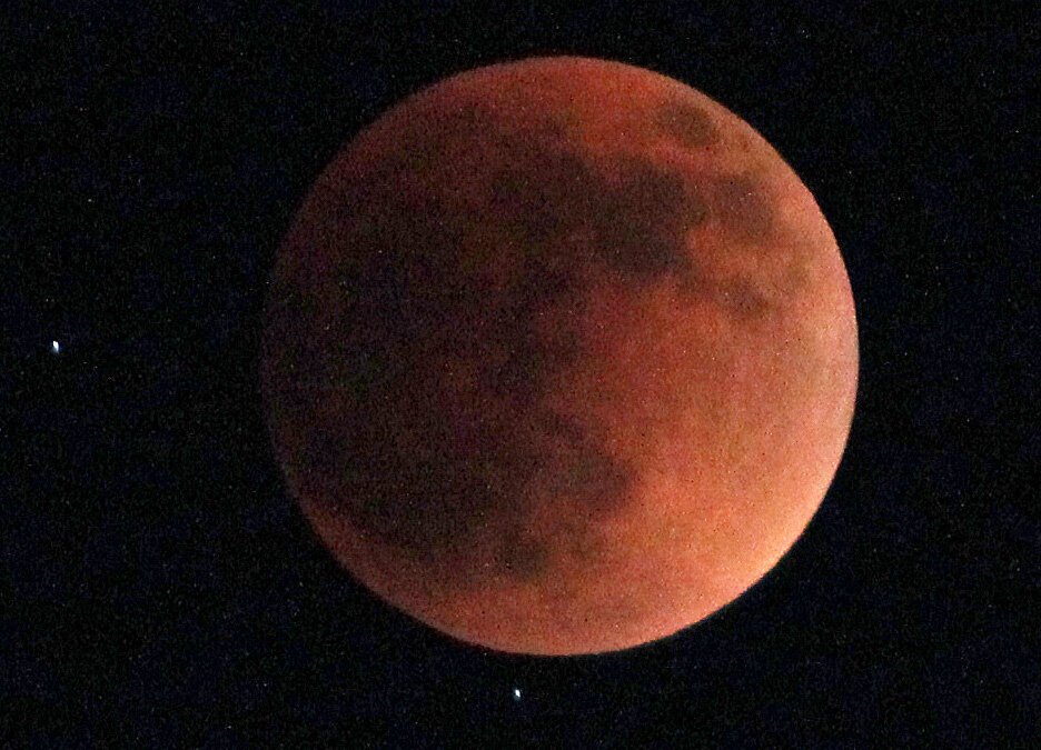 The total lunar eclipse Sunday evening created a glowing red "blood moon."