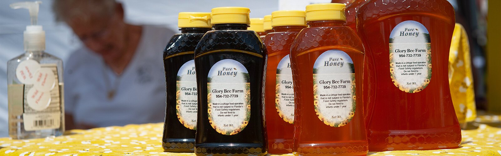 Bottles of ‘pure honey’ from Glory Bee Farm are displayed at The Market Marie in Clearwater.
