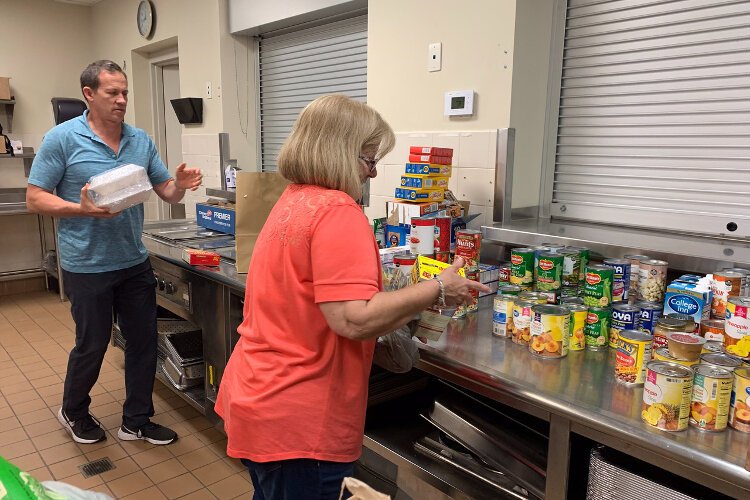 Volunteers with South Tampa Fellowship set up a food pantry to help  Afghan refugees who have settled in Tampa Bay. 