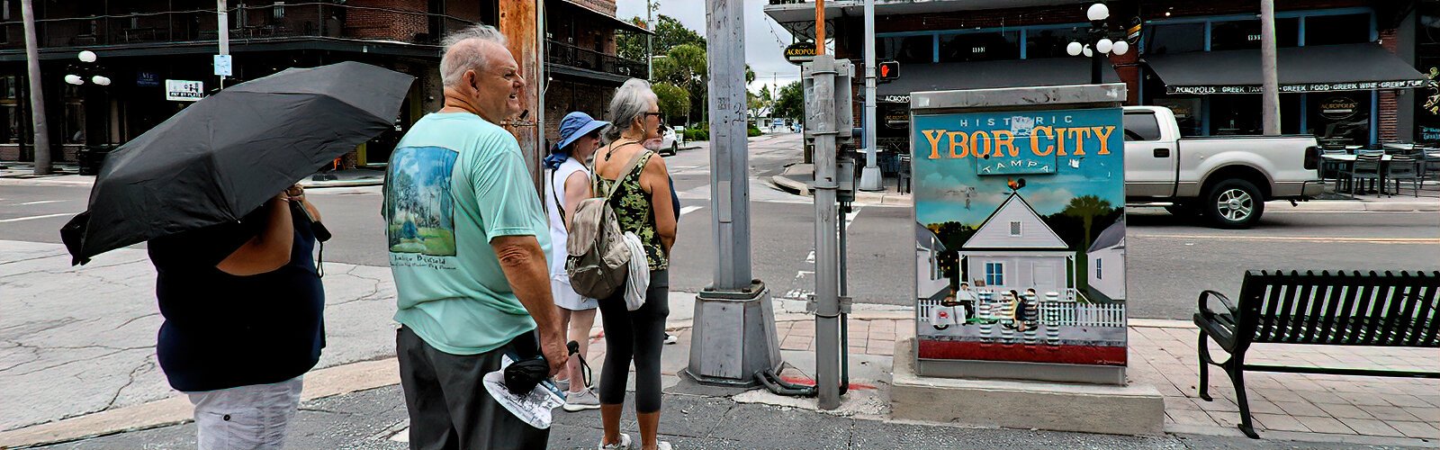 Participants walk through Ybor City, Tampa’s only National Historic Landmark District, during a walking tour organized by Tampa Bay History Center.