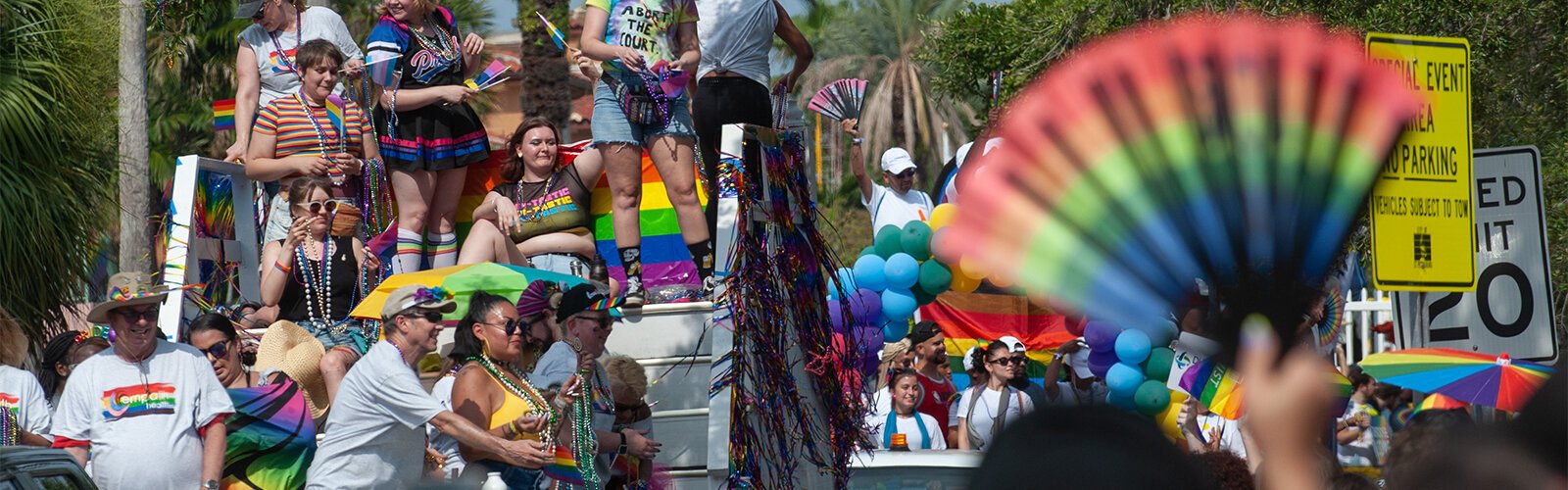 The crowd gathers for a chance at beads and other items tossed from floats at this year's St Pete Pride Parade.
