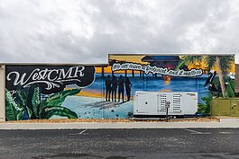 The mural on the headquarters of Clearwater's WestCMR reads "We all leave a footprint and it matters," a philosophy that guides company founder Randy Ware.