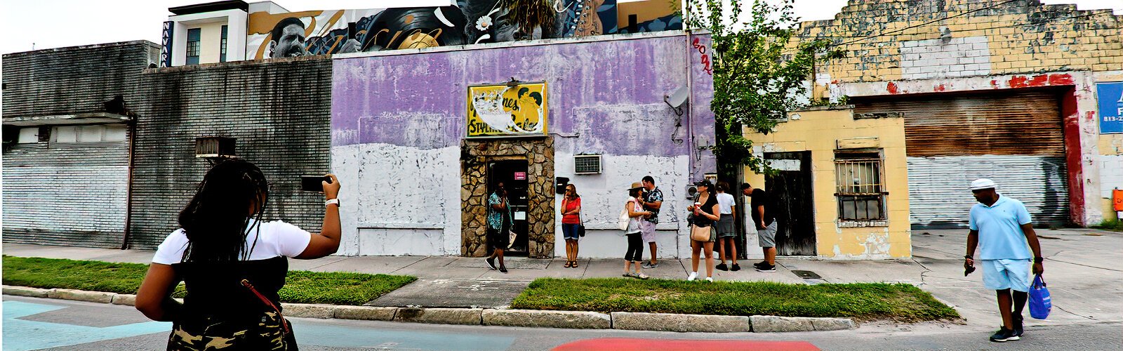 Tour guide Ersula Odom takes participants through Tampa’s Central Park district, originally known as The Scrub, where only a handful of old buildings remain.