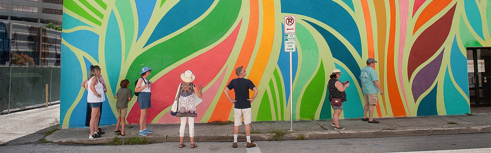  A colorful leafy looking wall mural by artist Cecilia Lueza titled “Elysian Days" is part of the public art walk.