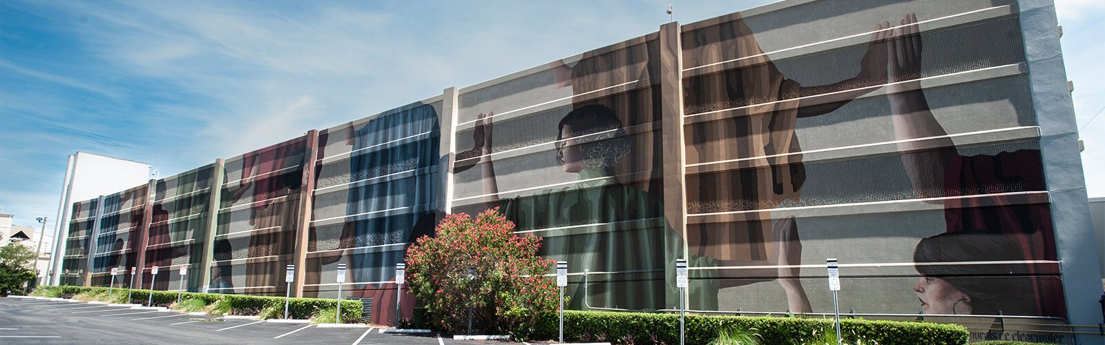 Artists Florencia Duran and Camilo Nunez created the mural “Comunidad” on the side of a downtown Clearwater public parking garage.