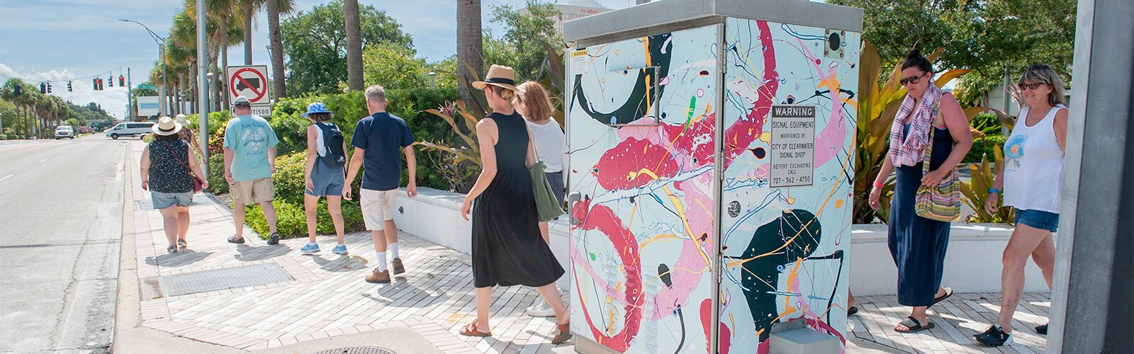 Downtown Clearwater features several painted traffic signal boxes. This one, by artist Ray Paul, is simply titled "Tour."