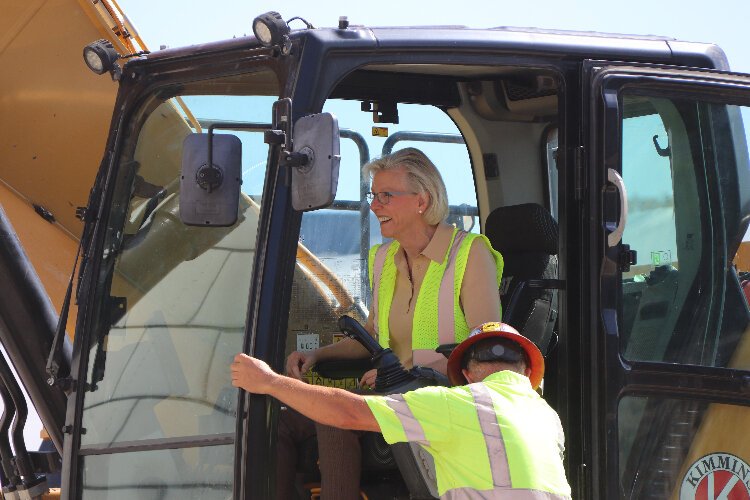 Tampa Mayor Jane Castor uses an excavator to ceremoniously start the demolition of the downtown Ardent Mills flour mill.