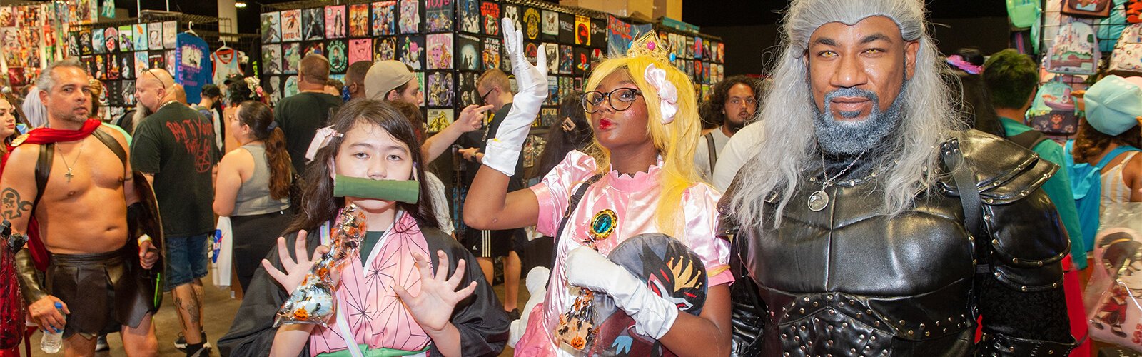 Dressed as The Witcher, Chris Warren brought his daughter, who dressed as Princess Peach, and her friend, who went as Nezuko Kamadod, to the Tampa Bay Comic Con.
